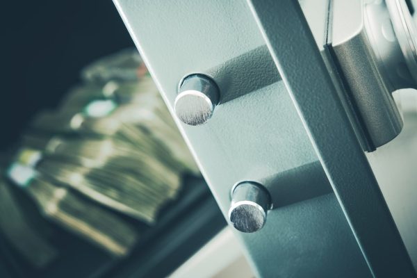 Money in the Residential Safe Box Closeup Photo. Cash Money Safe Deposit.